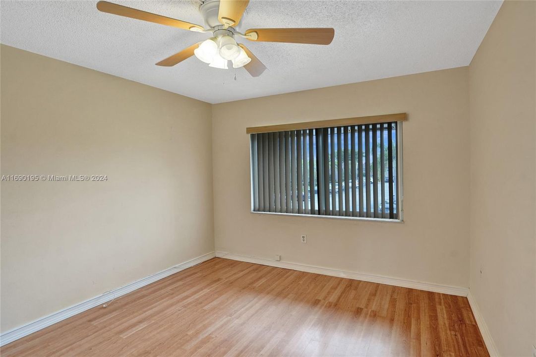 Wood floors bring neutrality to this guest room!