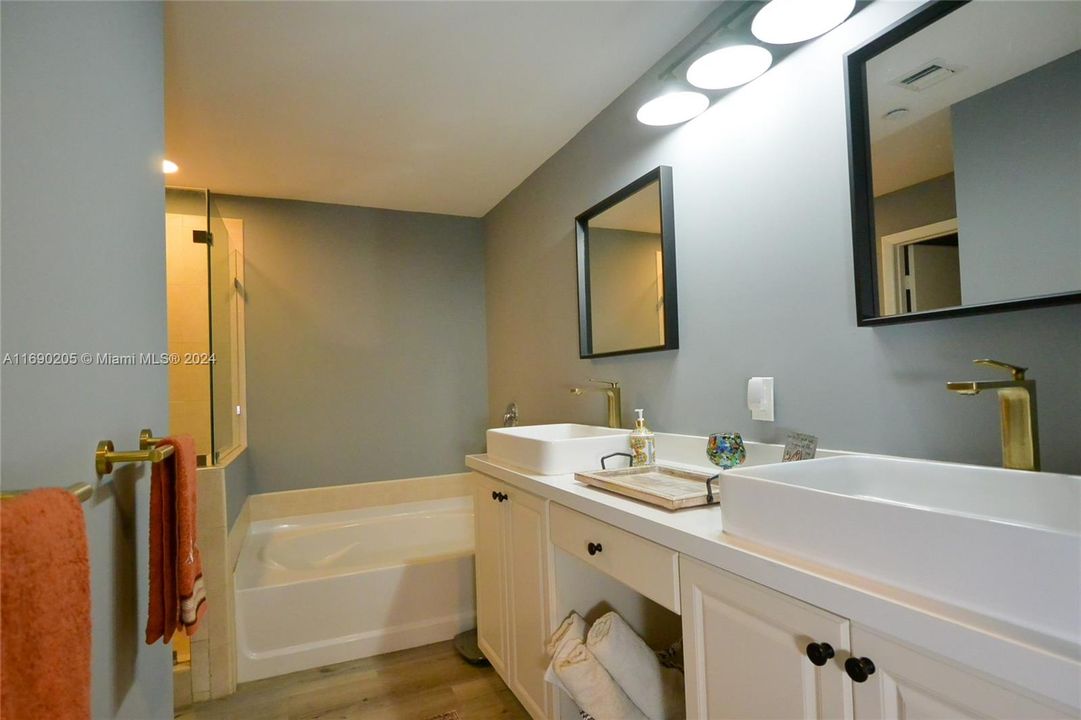 Primary bath with separate full shower, soaking tub and two sinks