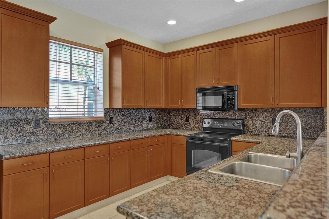 Kitchen Countertops are now WHITE... new pics coming soon!