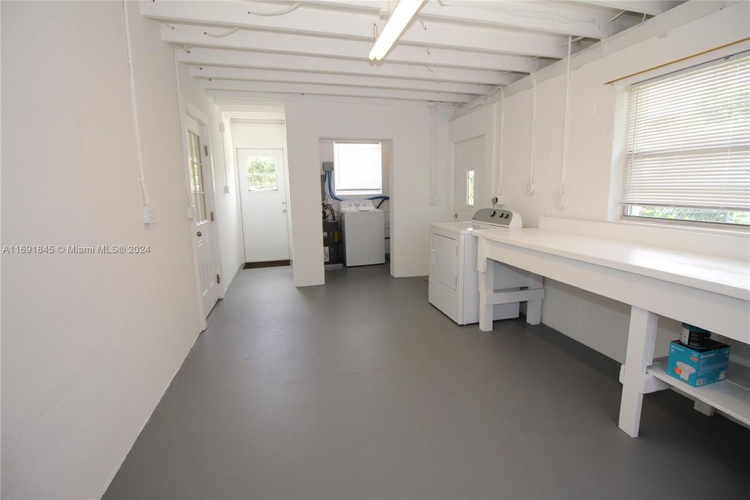 Laundry room with plenty of extra storage space.