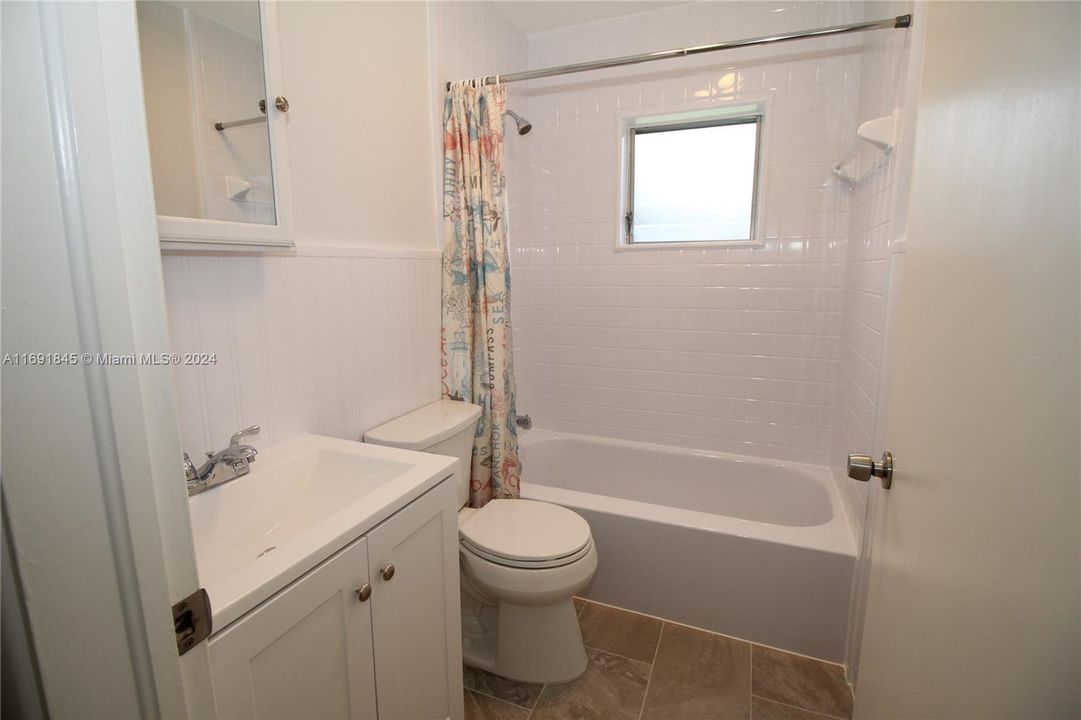 One of two full bathrooms . Newly updated.