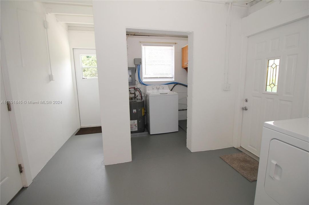 Laundry room with plenty of extra storage space.