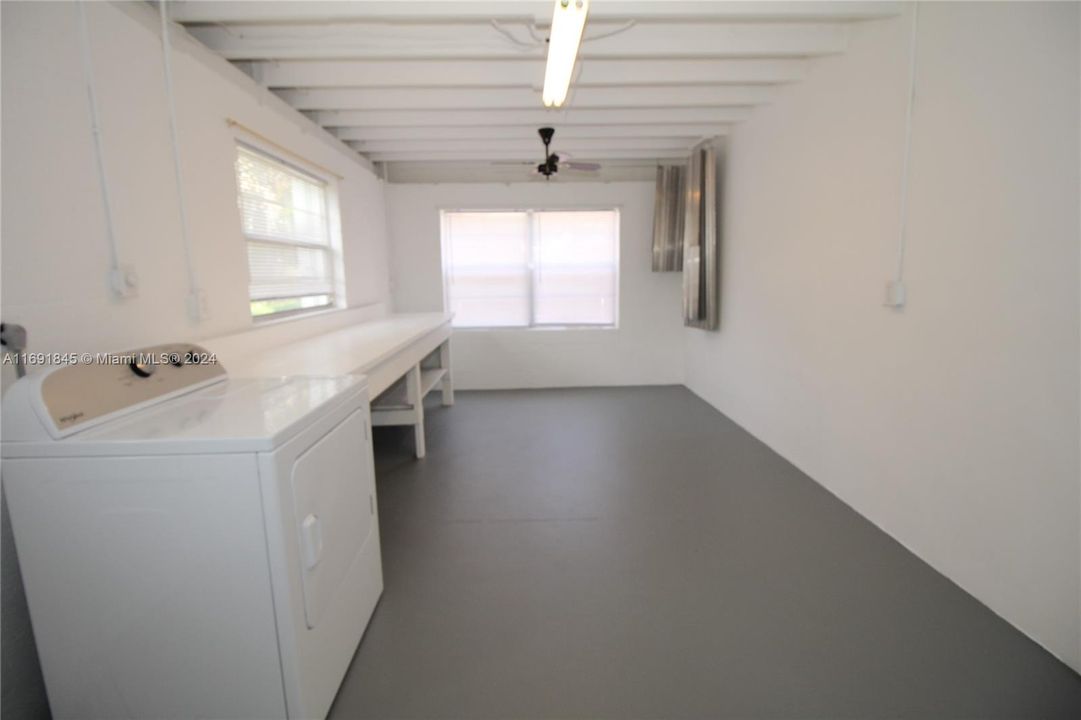 Laundry room with plenty of extra storage space.