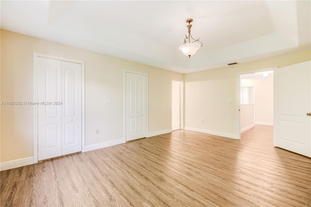 Master bedroom with two walking closets.