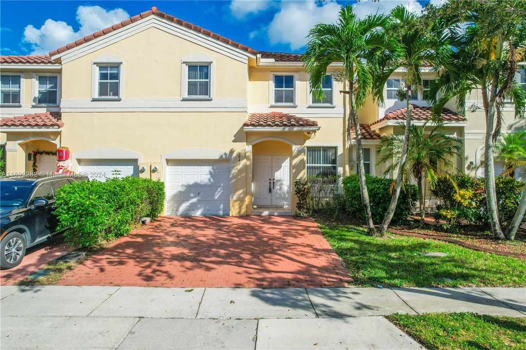 1 car garage with two additional parking spaces in front of the property.