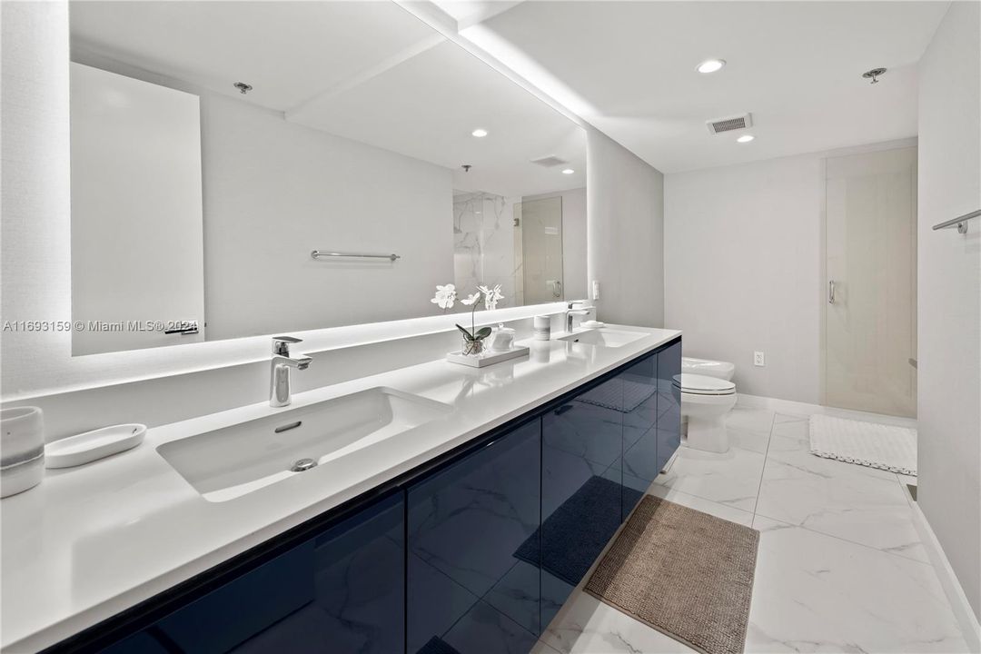 Master bathroom with double sinks.