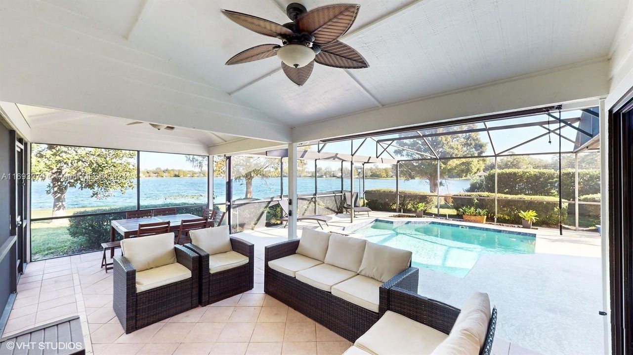 sitting area with pool and lake views