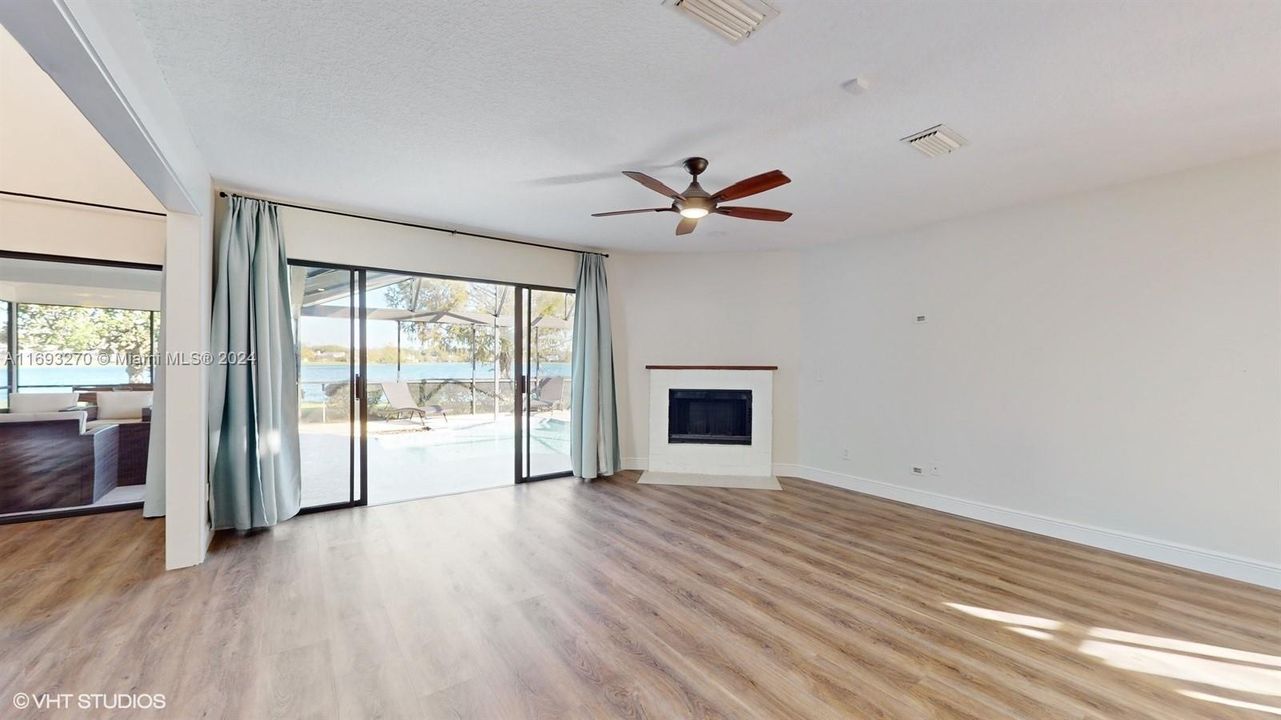 Dining room sliding door to pool and lake view