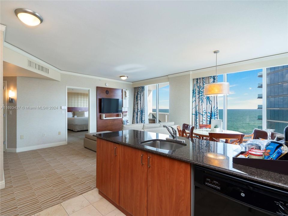 full kitchen with oven, stove top and dishwasher