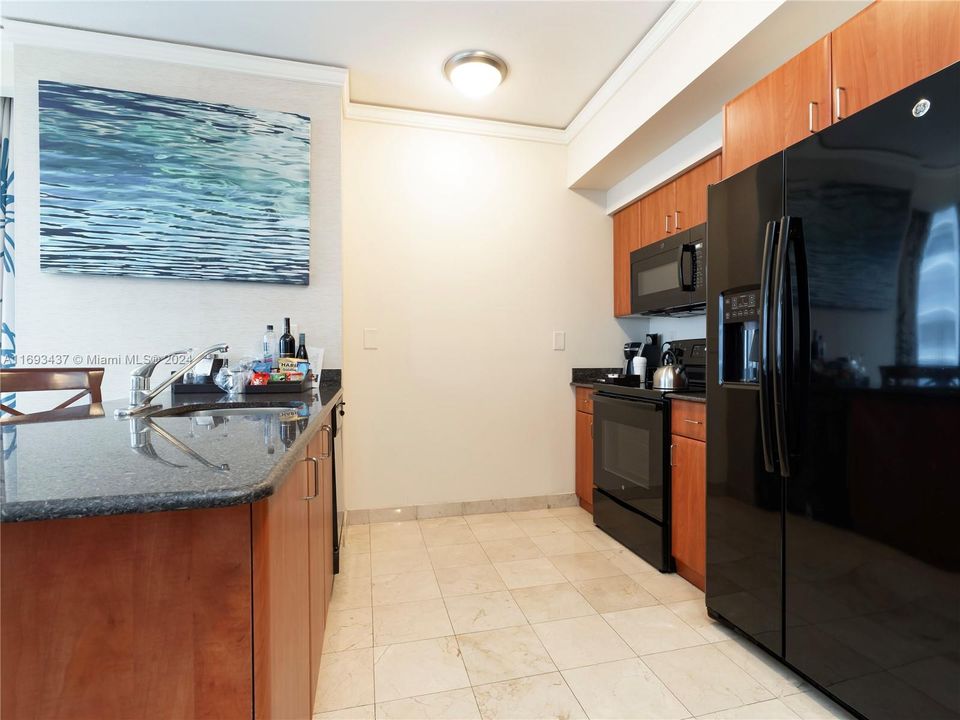 full kitchen with oven, stove top and dishwasher