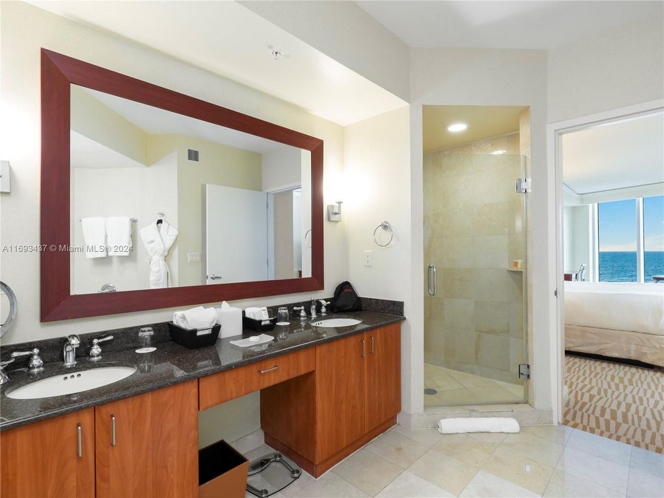 large oversized main bathroom with dual vanity sinks