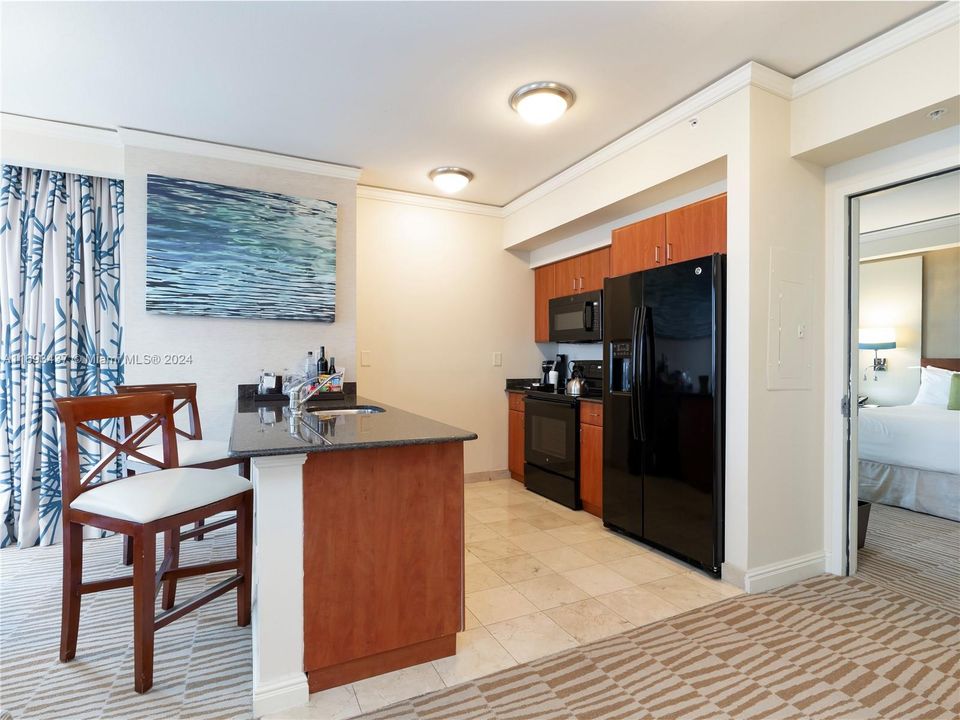 full kitchen with oven, stove top and dishwasher