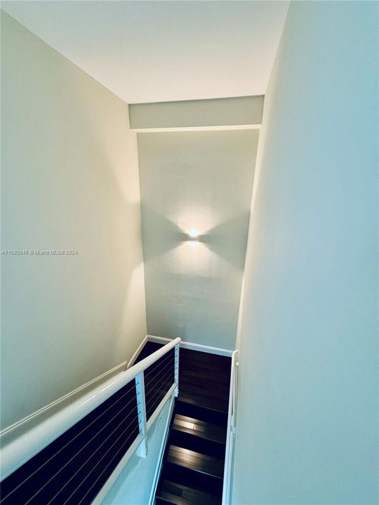 Staircase leading to master bedroom