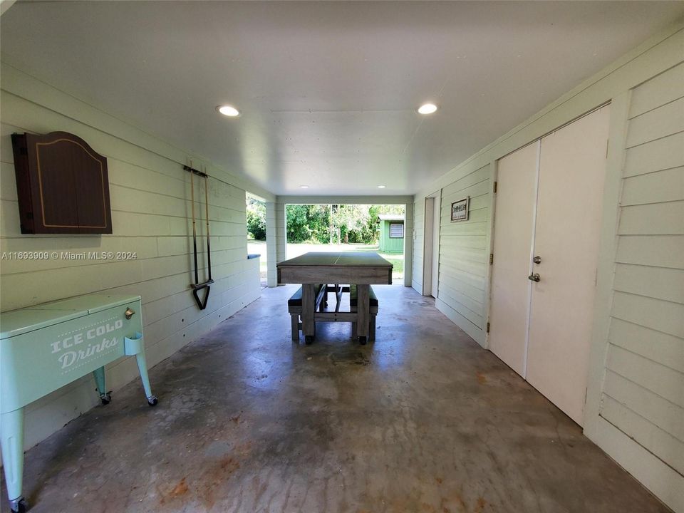 Ping-pong/ Pool Table, Darts & cooler. Laundry on right, facing driveway