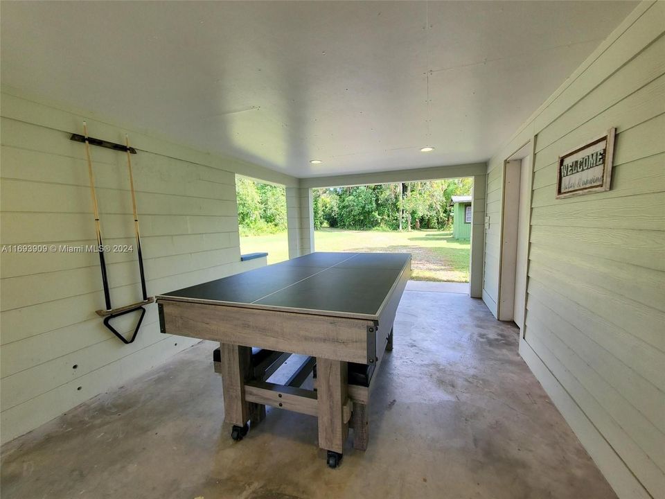 Ping-pong/ Pool Table. Laundry on right, facing driveway