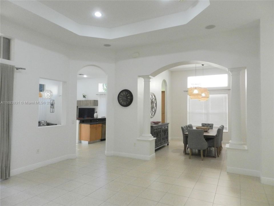 Formal living room (unfurnished) looking into formal dining room