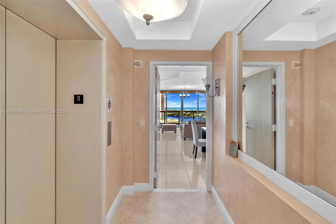 YOUR ELEVATOR OPENS INTO A LARGE PRIVATE FOYER