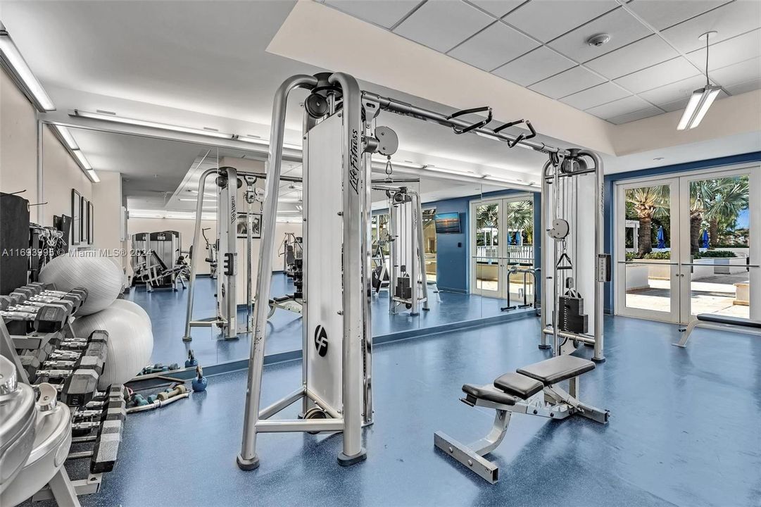 GYM OVERLOOKS THE POOL