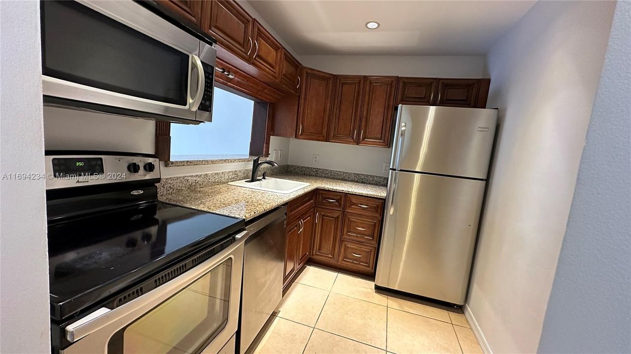 Wood cabinetry and Granite counter tops.