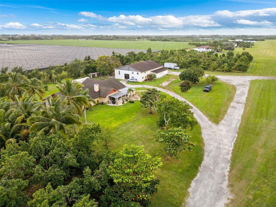 DRIVEWAY INTO PROPERTY PAST GROVE AND PALM FIELDS. THE AIR STRIP IS TO WEST..4/2 HOME PLUS HANGER AND 1/1 APT. LAND NEEDS CLEANUP... RICHARDS AIR FIELD...