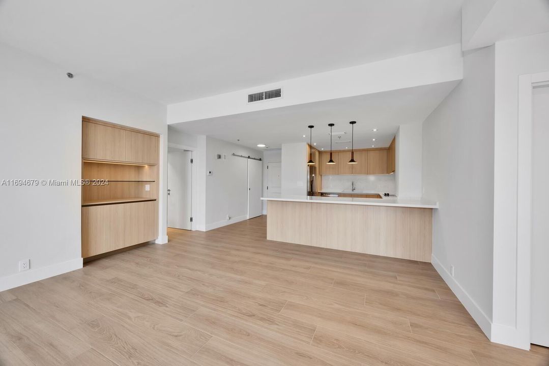 Living area to open kitchen.