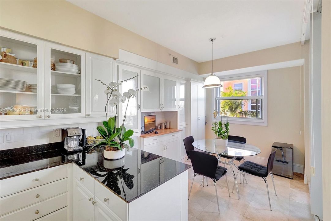 Light Kitchen with white cabinetry and granite counter tops