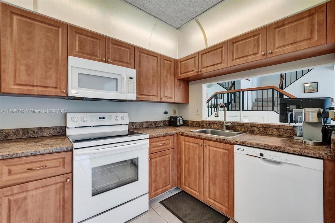 Kitchen has pass through to dining room