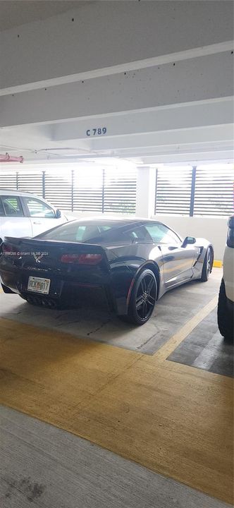 spacious safe DEEDED  parking spot covered in a garage