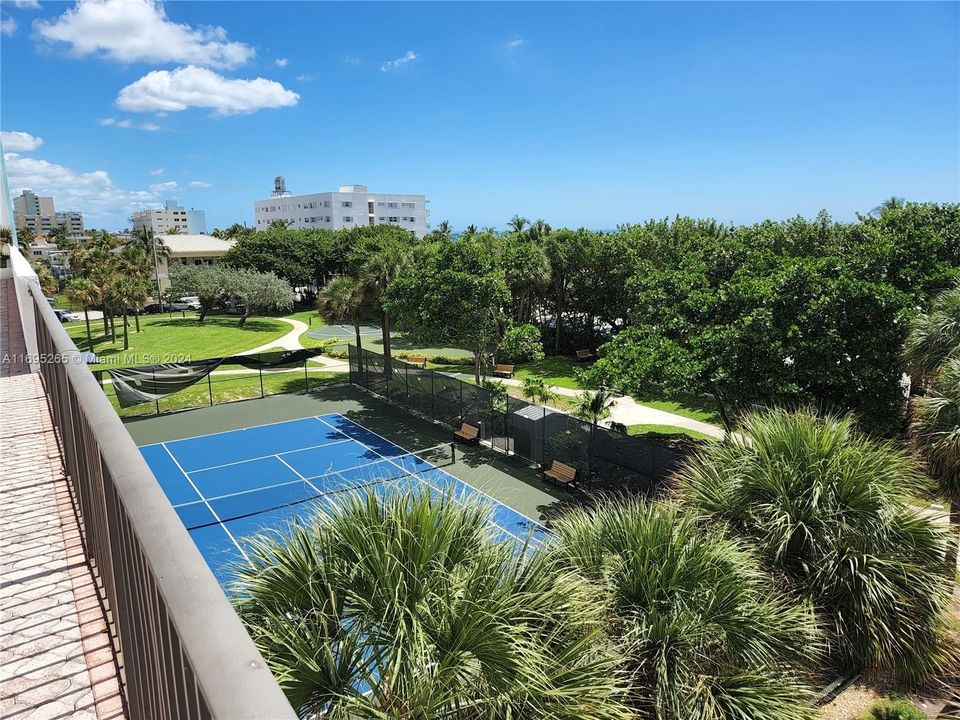 Lighted tennis court look at walking track area