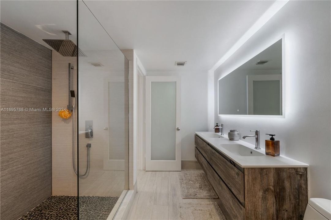 beautiful bathroom on the first floor with double vanity