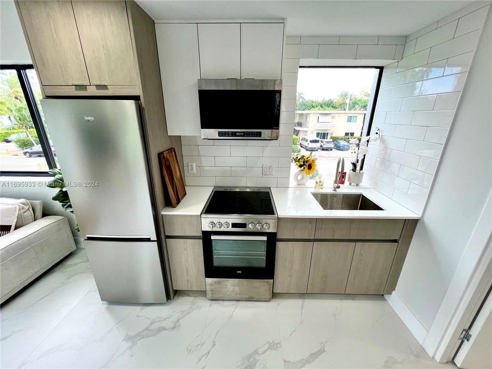 Kitchen with brand new stainless steel appliances