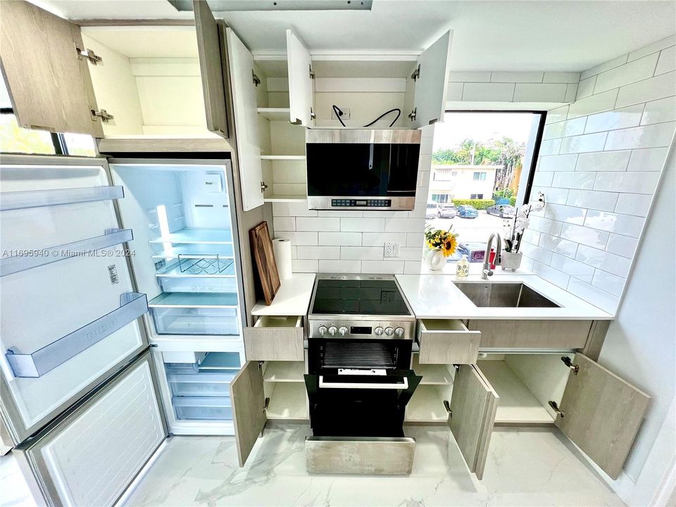 Kitchen with cabinets and storage opened