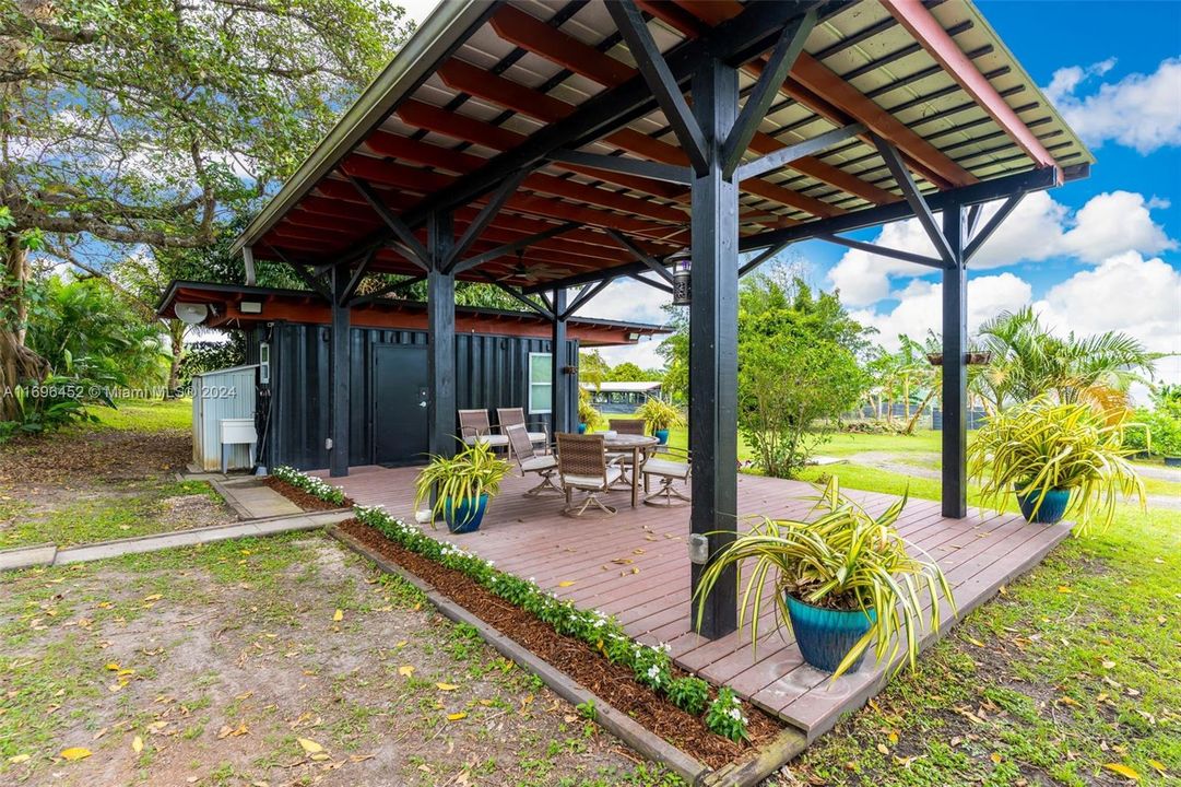 OFFICE WITH PERGOLA & PAVERS OVERLOOKING THE PROPERTY