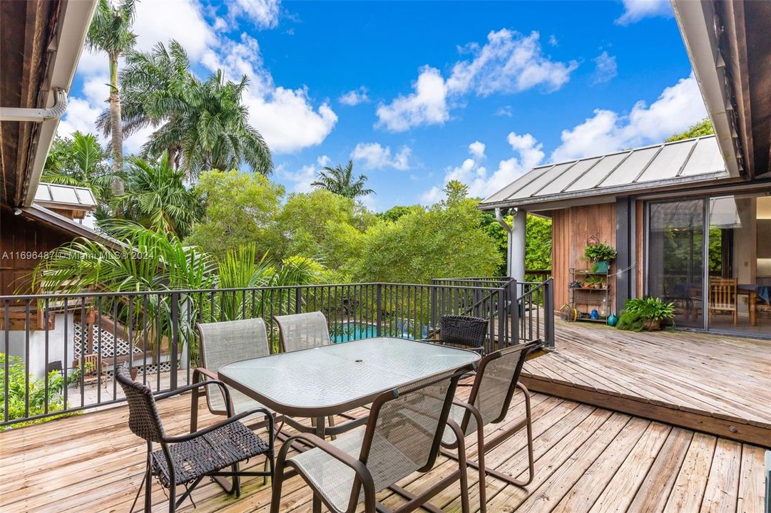 SITTING AREA ON THE UPPER DECK PATIO'S OVERLOOKING THE AMAZING POOL AREA.