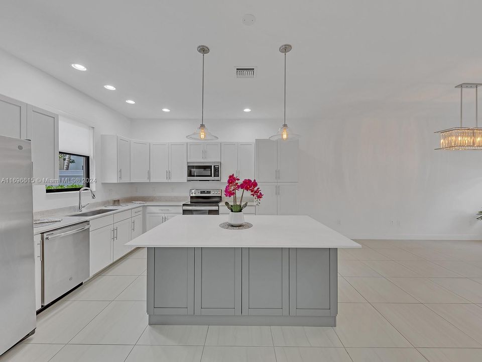 Underneath cabinets on both side of gorgeous island