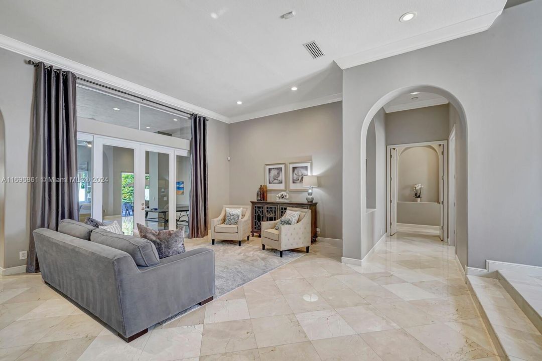 Front living room with marble floors.