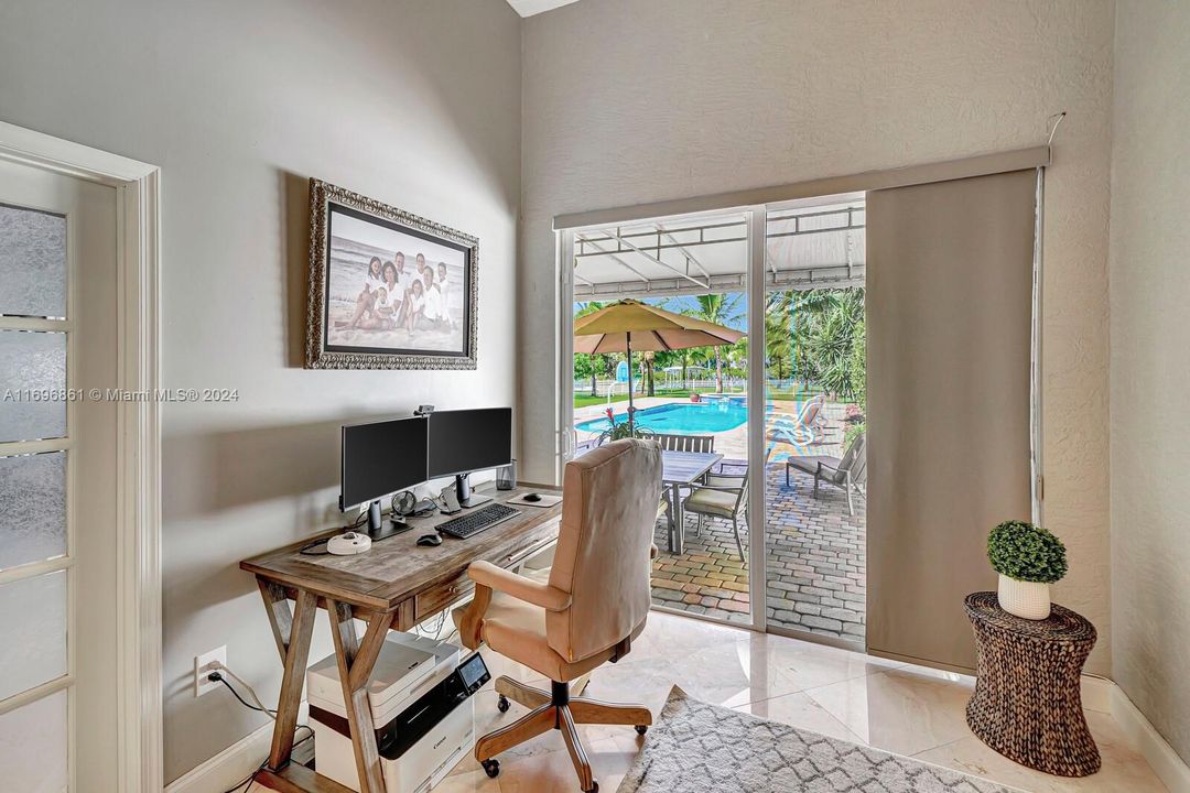 Office/Den off of Primary bedroom overlooking pool.