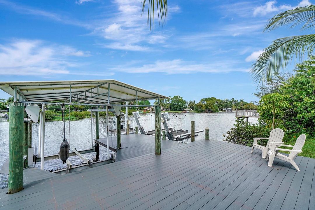 Private boat Dock with boat lift and 3 wave runner lifts.