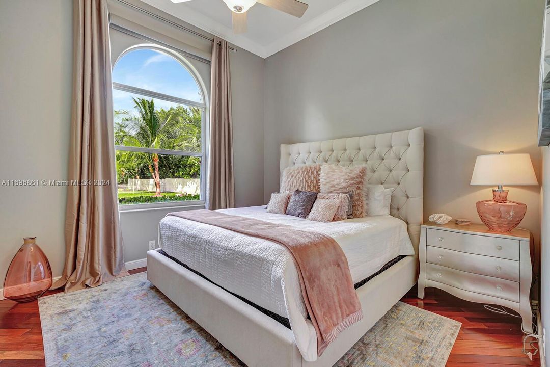 Bedroom with view of pool and Lake Osborne