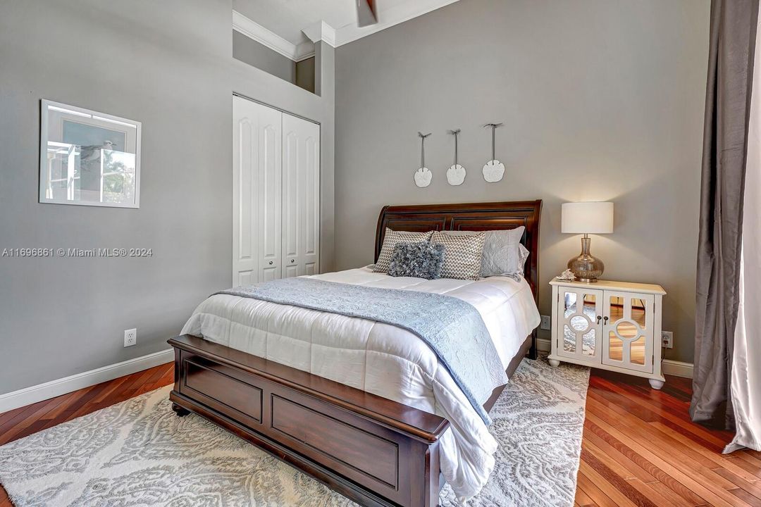 Bedroom with private screened sun porch.