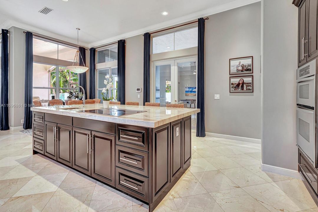 Kitchen Island with cook top and extra sink.