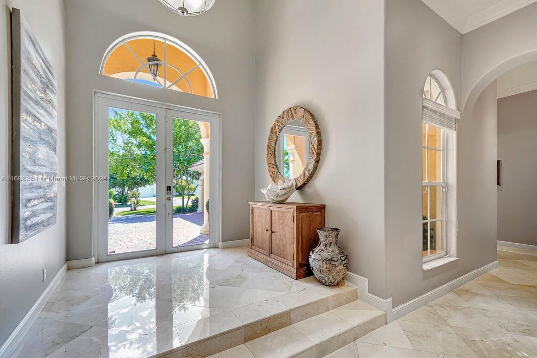 Marble floor entry with step down into entry and living room