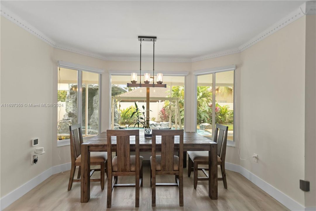 Kitchen Dining overlooking Pool and yard