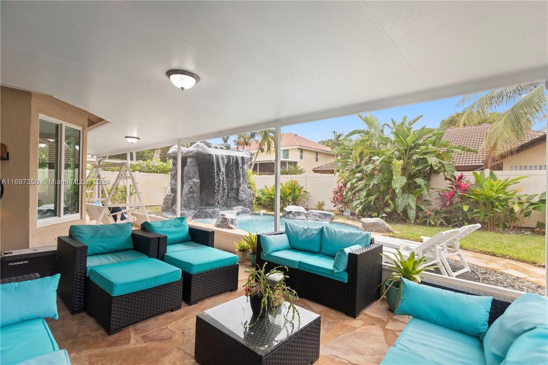 Screened-In Patio with living room and dining space