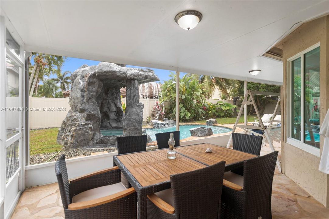 Screened-In Patio with living room and dining space