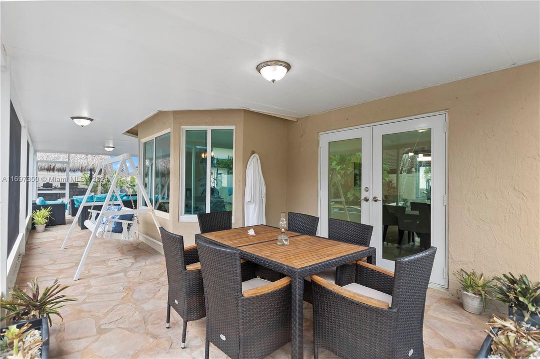 Screened-In Patio with living room and dining space