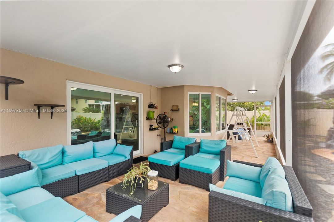 Screened-In Patio with living room and dining space