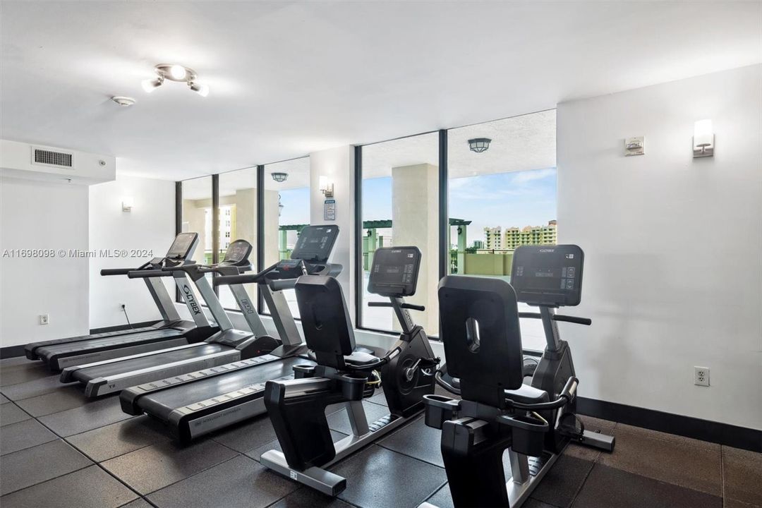 Gym overlooking the pool area