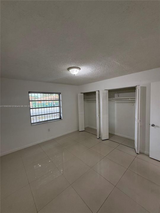 1st bedroom, with his and hers closet.