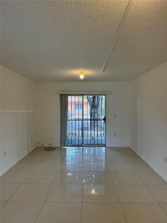 Living room opens up to balcony.